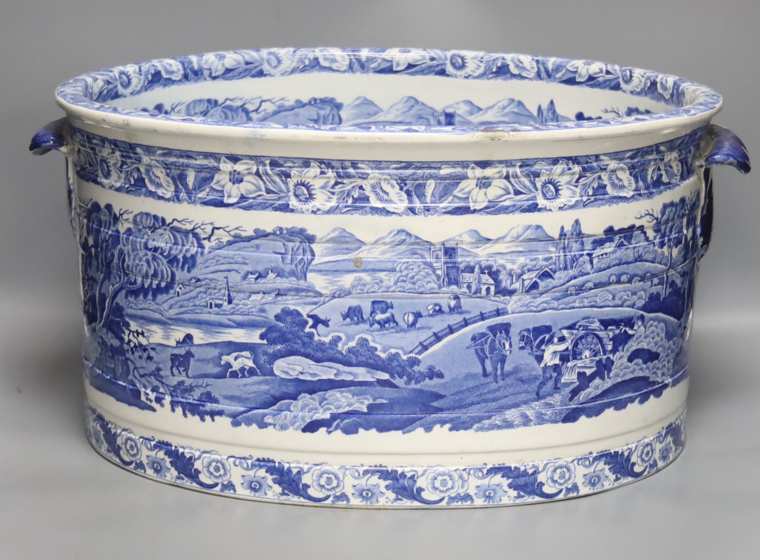 A Victorian Staffordshire blue and white footbath by T. Rathbone & Co., two handled, impressed marked, width 48cm